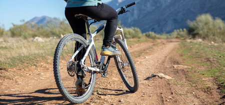 close up on legs of woman on bike in nature