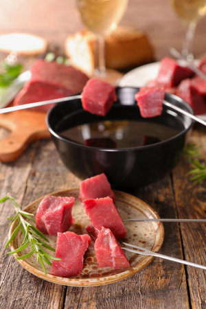 Fondue Bourguignonne with Beef, Oil, and Wine â Gourmet Dining Experienceの写真素材