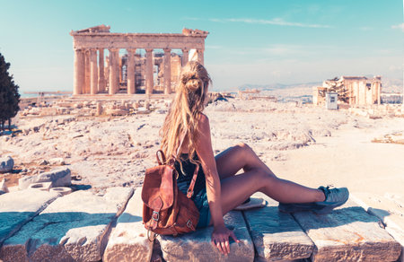 Young female tourist looking at Parthenon Athens Greece templeの写真素材