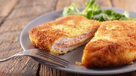 Cordon bleu on plate with greensの写真素材