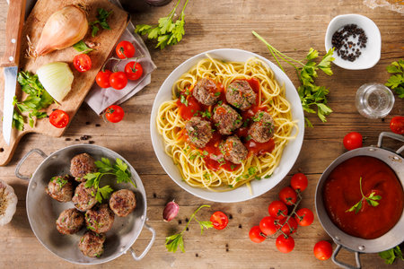 spaghetti with tomato sauce and grilled meatballの写真素材