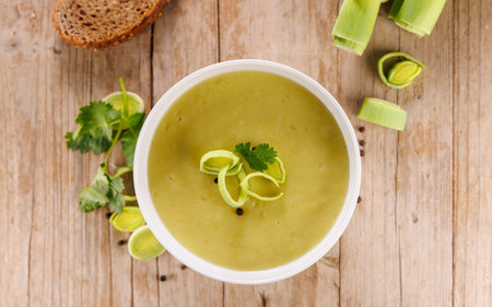 leek soup on wooden backgroundの写真素材