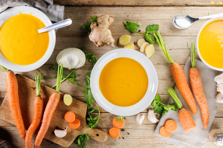 bowl of vegetable soup on wooden tableの写真素材