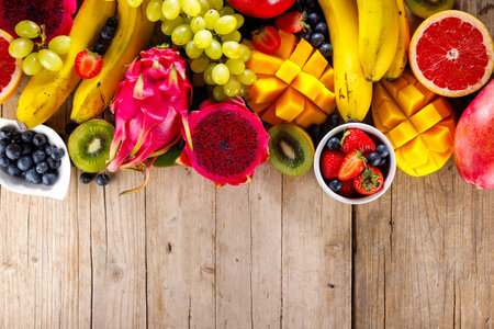 assorted of fresh fruits, dragon fruit, banana, berry, kiwi, mangoの写真素材
