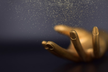 Glitter falling in handの写真素材