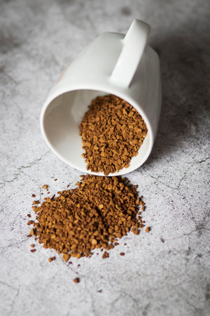Instant coffee with white cup on gray backgroundの写真素材