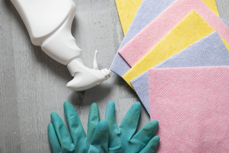 Cleaning. Washing the window and table with a napkin and gloves.の写真素材