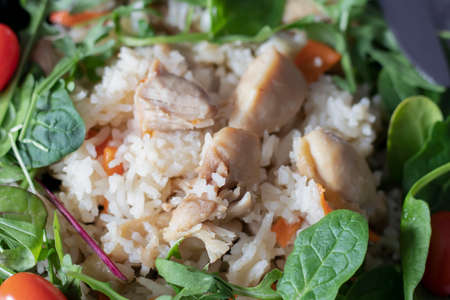 Rice pilaf with meat and vegetables. On a gray backgroundの写真素材