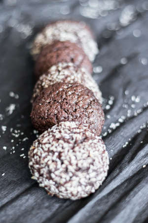 Chocolate chip cookies with coconut. Lie on a black and gray background.の写真素材