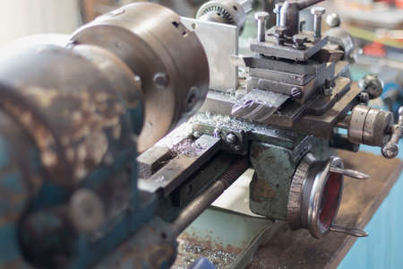 metalworking industry: working on a lathe with flying sparks. Latheの写真素材