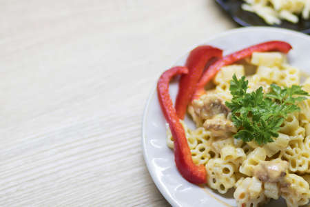 Macaroni and cheese, on the kitchen tableの写真素材