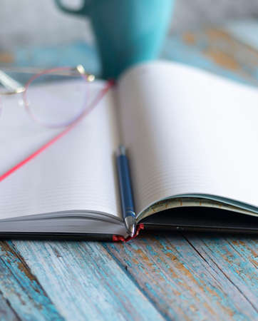 Workplace with notebooks and pen. Lie on the table.の写真素材