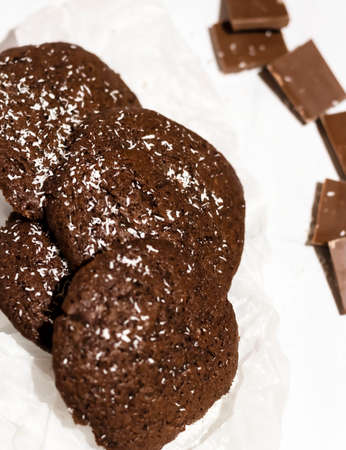 Chocolate chip cookies with coconut. Lying on a white background