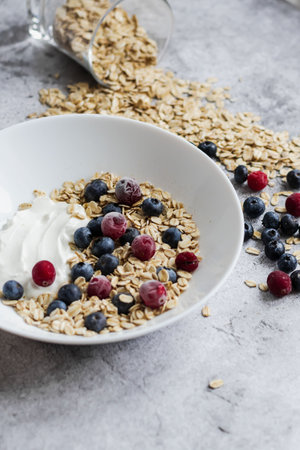 Healthy breakfast with muesli, yogurt and fresh berries.