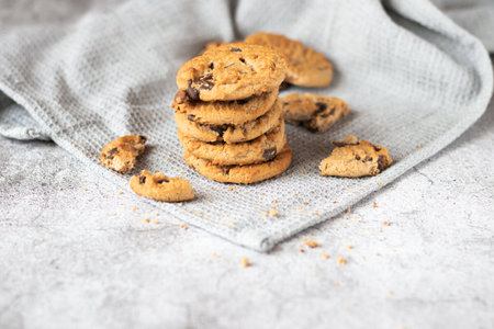 Chocolate chip cookies on linen napkin, selective focus, close upの写真素材