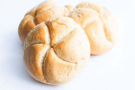 Bread rolls on white background, soft focus and vintage tone.の写真素材