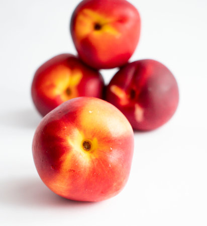 Ripe nectarines on a white background, close-upの写真素材
