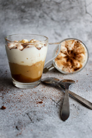 Coffee latte in a glass on a gray background.の写真素材