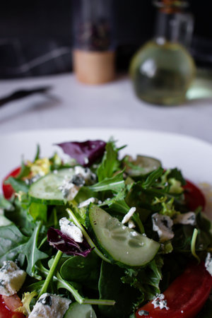 Fresh salad with feta cheese, cucumber and arugulaの写真素材