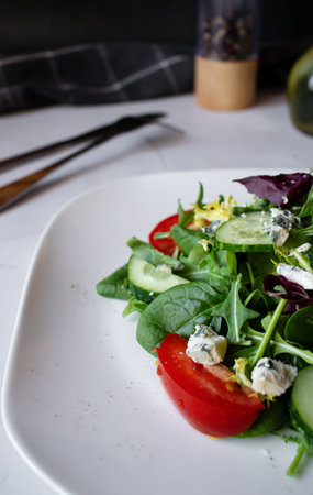 fresh salad with blue cheese, cucumber, arugula and cherry tomatoesの写真素材