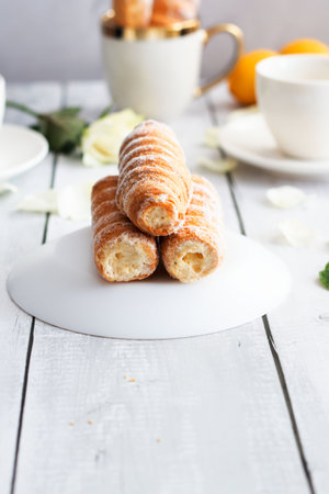 Creamy croissants on a white wooden table, selective focus