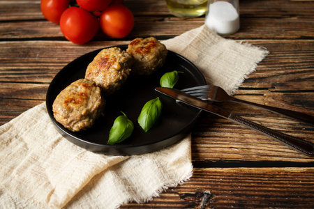 fried meatballs on a dark wooden background. tinting. selective focus
