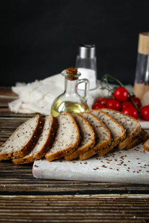 Slices of bread with oil on a wooden background. Selective focus.の写真素材