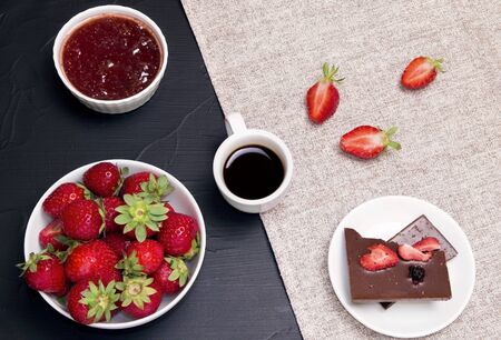 breakfast with strawberries. Coffee and chocolate with strawberries. strawberry jam, a bowl of fresh strawberriesの写真素材