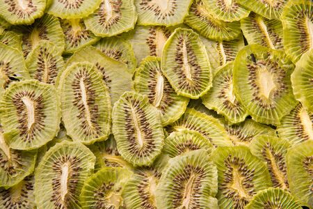 Kiwi fruit chips texture. Useful snacks.の写真素材