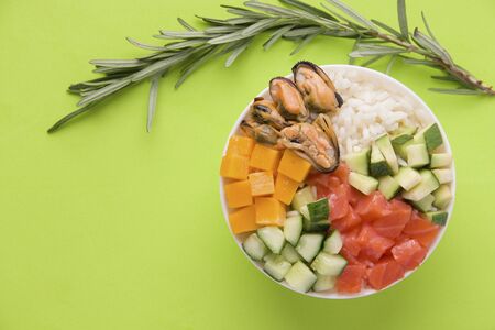 Hawaiian poke salad on green background copy spaceの写真素材