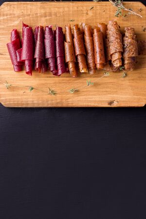 Pastille, fruit rolls without sugar on a white background. there is a place for copy space