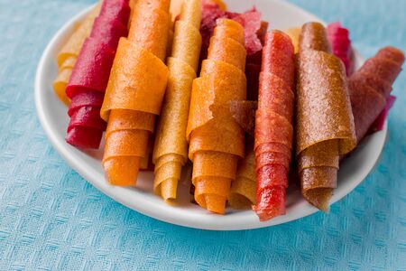 Pastilla, fruit rolls without sugar close-up on a blue clothの写真素材