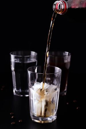 coffee drink with ice on a black backgroundの写真素材