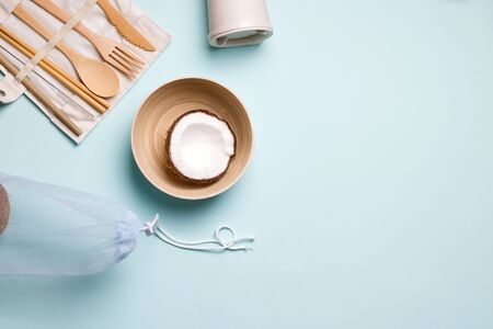 eco kitchen utensils made of bamboo and wood on a blue background. have copy space. zero waste conceptの写真素材