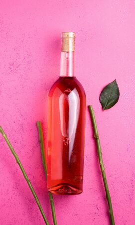 rose wine on a pink background. Vertical imageの写真素材