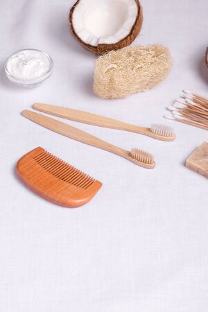 eco body care products made of wood, bamboo and loofah on linenの写真素材