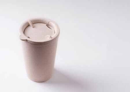 Reusable cup made of straw on a white background copy spaceの写真素材