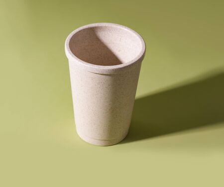 reusable coffee cup on a green background. minimalismの写真素材