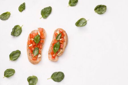 Bruschetta is a traditional Italian appetizer. sandwich with tomato, garlic, basil and olive oil