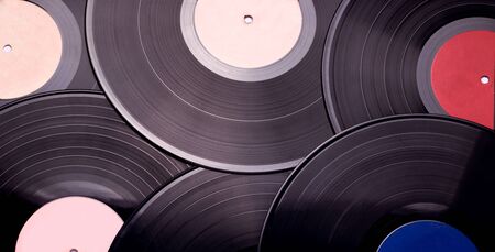 texture of musical vinyl records in black closeup.の写真素材