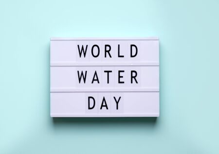 holiday world water day. lightbox inscription on blue backgroundの写真素材