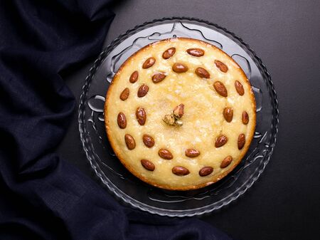 oriental confectionery based on semolina arabic Busbus pie on a black backgroundの写真素材