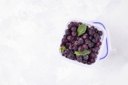 berries of frozen currants on a white background. top view. copy spaceの写真素材