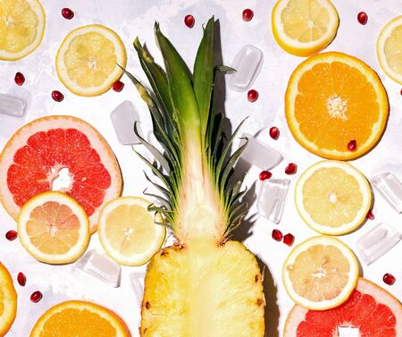 Tropical sliced fruits close-up on a white backgroundの写真素材