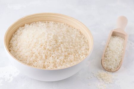 uncooked rice on a gray concrete backgroundの写真素材