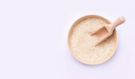 rice in a bowl of bamboo on a white background. copy space. bannerの写真素材