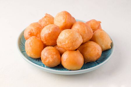 Arabic sweet dessert lokma on a white backgroundの写真素材