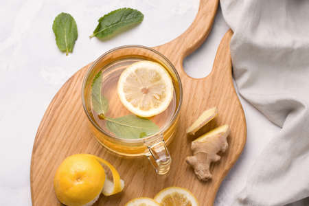 Healthy food. Lemon in a jar with honey and ginger on a white background. Copy spaceの写真素材