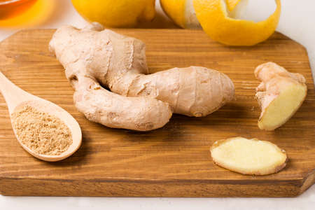 Healthy food. Lemon in a jar with honey and ginger on a white background. Copy spaceの写真素材