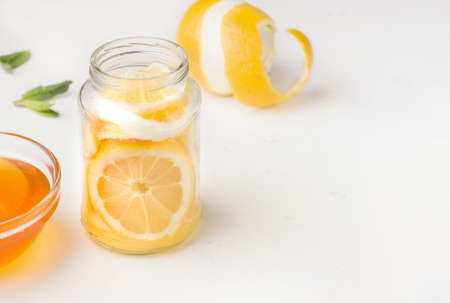 Food useful for immunity. Lemon in honey-sugar syrup on a white background. Copy spaceの写真素材